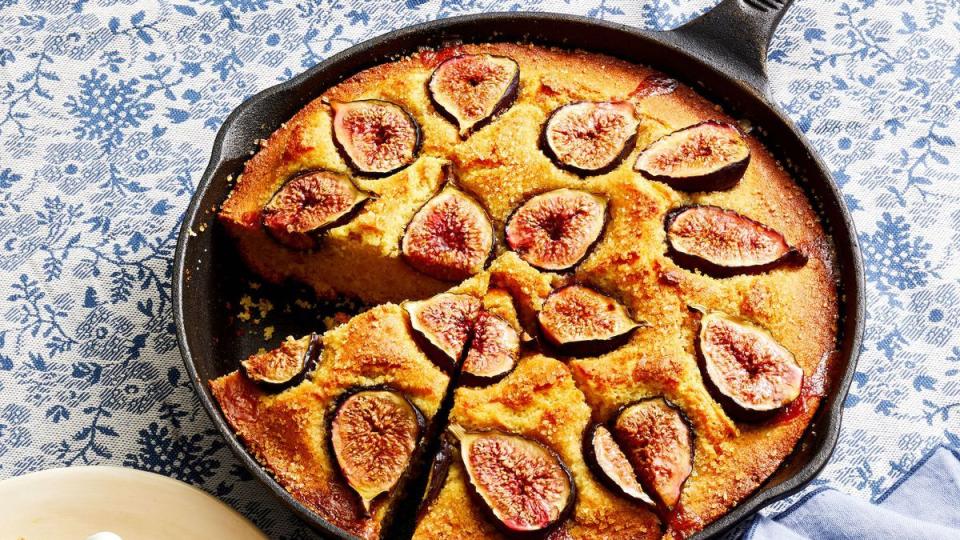 fig cornmeal cake in a cast iron skillet