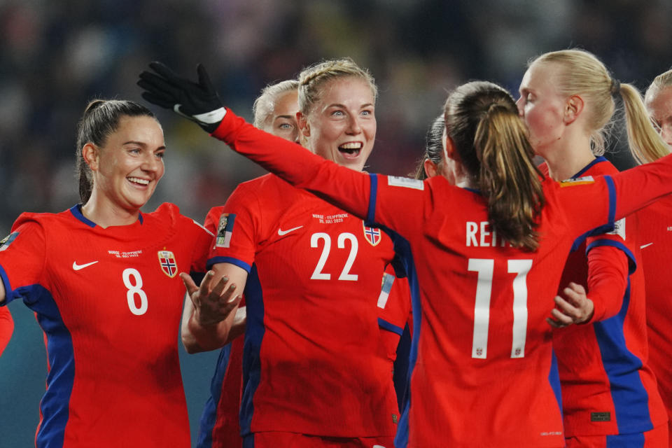 Norway's Sophie Roman Haug, center, celebrates with teammates after scoring their side's sixth goal during the Women's World Cup Group A soccer match between Norway and Philippines at Eden Park stadium in Auckland, New Zealand, Sunday, July 30, 2023. Sophie Roman Haug scored a hat trick in Norway's 6-0 victory. (AP Photo/Abbie Parr)