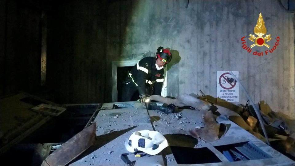 A firefighter works at the site after a blast at a hydroelectric power plant in Bargi, Italy (VIA REUTERS)