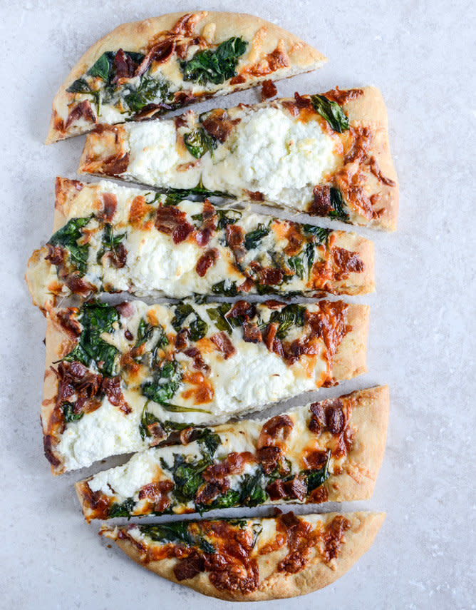 <strong>Get the <a href="http://www.howsweeteats.com/2014/01/white-pizza-with-spinach-and-bacon/" target="_blank">White Pizza with Spinach and Bacon recipe</a> from How Sweet It Is</strong>