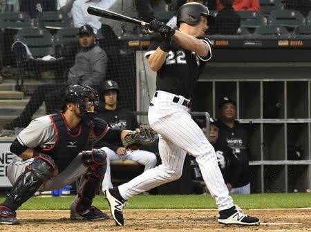 Jun 11, 2018; Chicago, IL, USA; Chicago White Sox left fielder Charlie Tilson (22) hits a single against the Cleveland Indians during the second inning at Guaranteed Rate Field. Mandatory Credit: David Banks-USA TODAY Sports