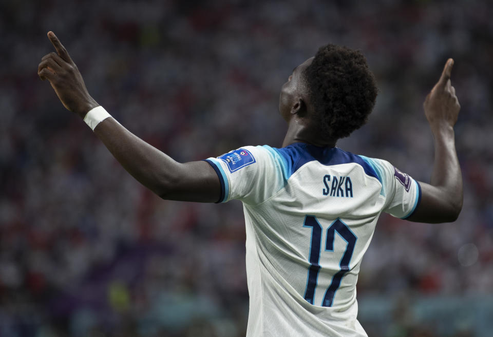 DOHA, QATAR - NOVEMBER 21: Bukayo Saka of England celebrates scoring during the FIFA World Cup Qatar 2022 Group B match between England and IR Iran at Khalifa International Stadium on November 21, 2022 in Doha, Qatar. (Photo by Visionhaus/Getty Images)