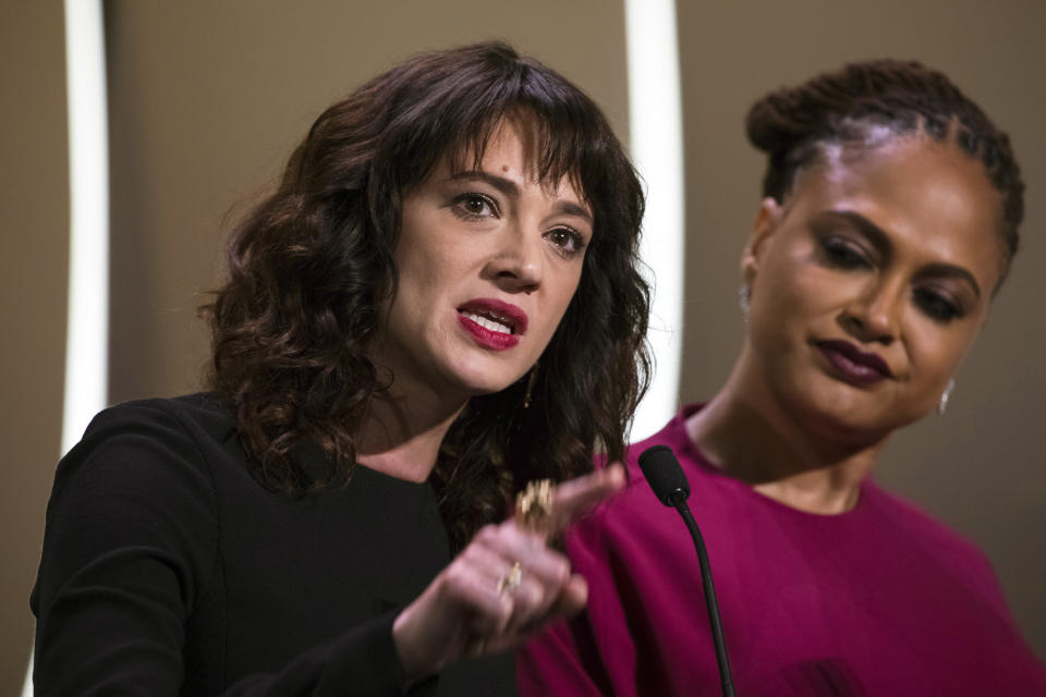 FILE - In this May 19, 2018 file photo, actress Asia Argento speaks about being raped by Harvey Weinstein as director Ava Duvernay looks on at right during the closing ceremony of the 71st international film festival, Cannes, in France. Argento, one of the most prominent activists of the #MeToo movement against sexual harassment, recently settled a complaint filed against her by a young actor and musician who said she sexually assaulted him when he was 17, the New York Times reported. (Photo by Vianney Le Caer/Invision/AP, File)