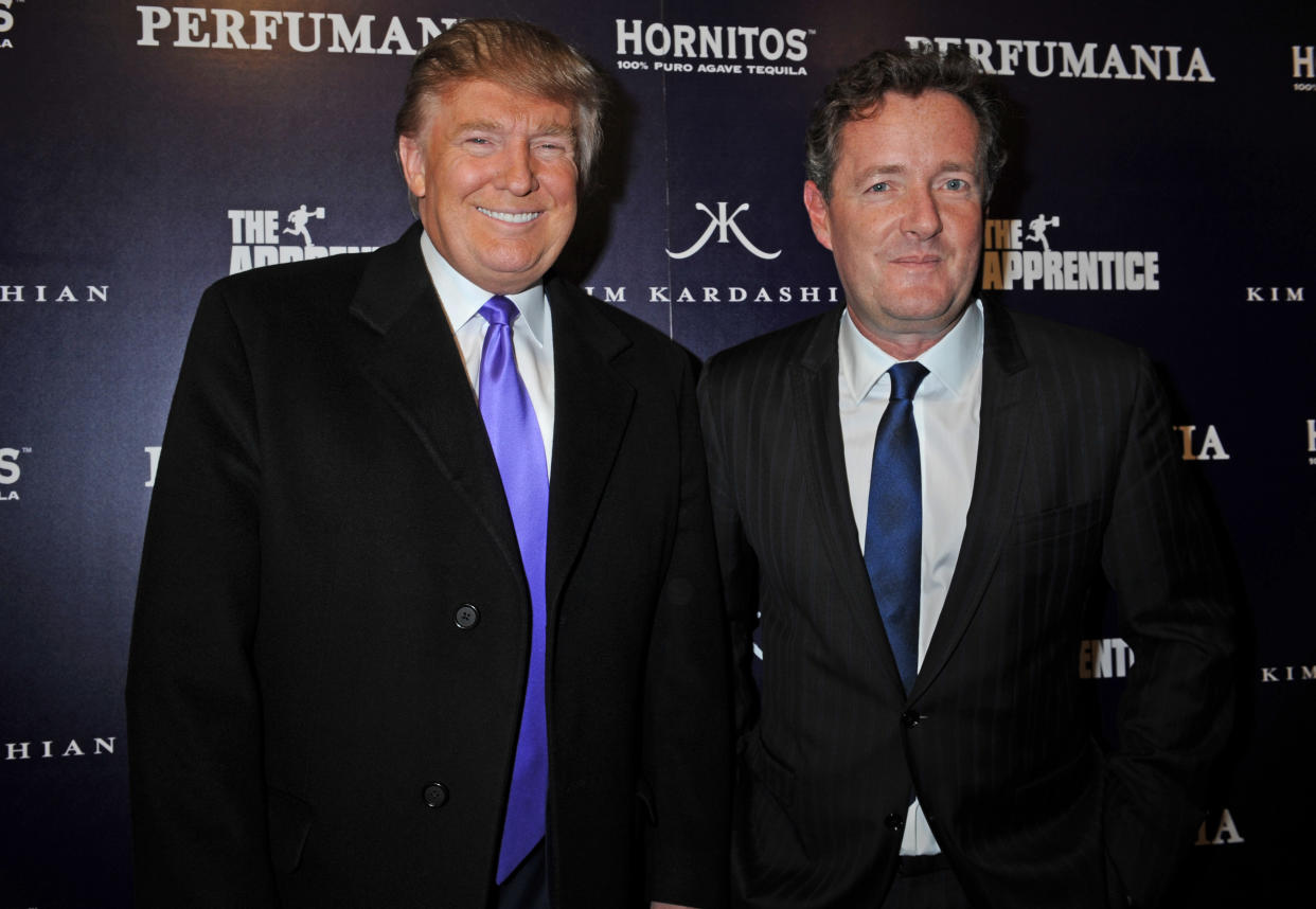 Donald Trump, left, and Piers Morgan arrive for the Perfumania party celebrating the appearance of Kim Kardashian on the reality show "The Apprentice", Wednesday, Nov. 10, 2010, in New York. (AP Photo/ Louis Lanzano)