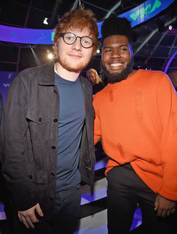 <p>Kevin Mazur/WireImage</p> Ed Sheeran and Khalid pose together at the 2017 MTV Video Music Awards.