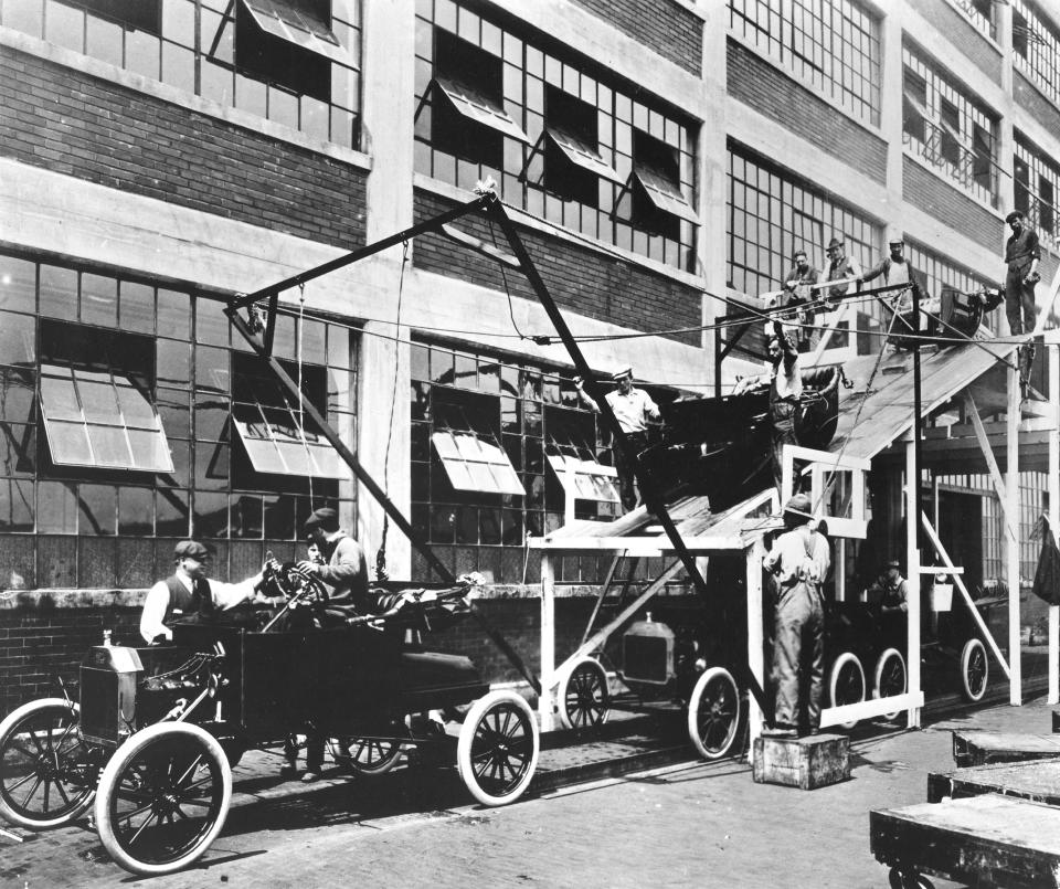 View of a portion of the assembly lIne for Model T automobiles at a Ford manufacturing plant (probably the one in Highland Park, Michigan), 1913. (Photo by PhotoQuest/Getty Images)