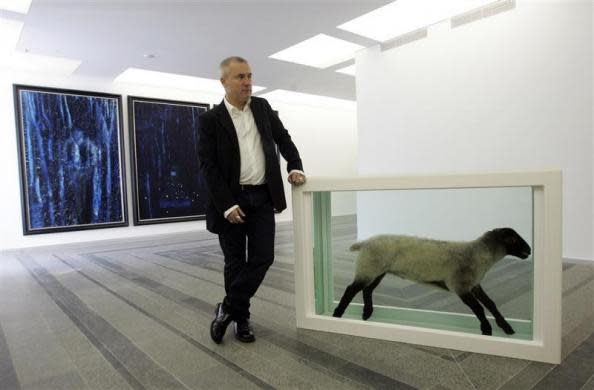 British artist Damien Hirst stands next to one of his sculptures during a press preview of his exhibition at the Pinchuk Art Center in Kiev April 23, 2009.