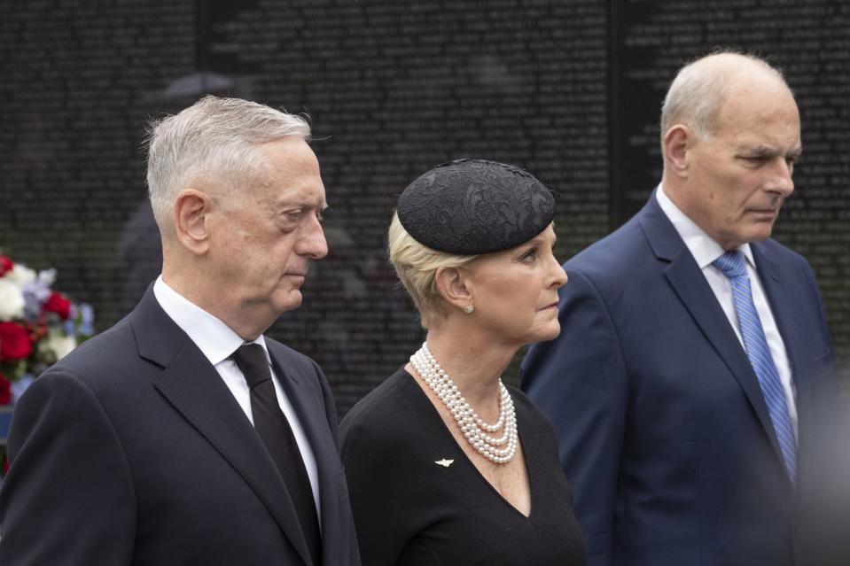 18) White House Chief of Staff John Kelly and Defense Secretary James Mattis walk with Cindy McCain