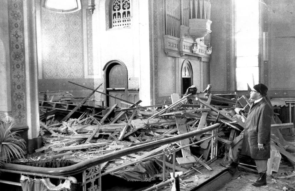 In the Mount Vernon Baptist Church, Rev. Julius Jackson Sr. views the rubble after bombing. The photo was taken Nov. 26, 1971, the day after the explosion.