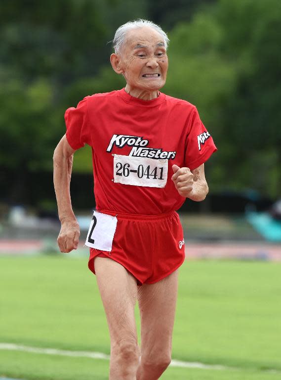 103-year-old Japanese sprinter Hidekichi Miyazaki runs during the men's 100m dash at a competition in Kyoto on August 3, 2014