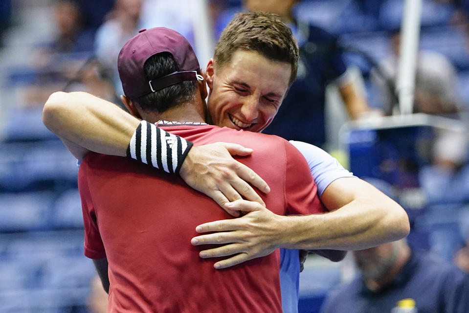 Joe Salisbury, right, of Great Britain, and Rajeev Ram, of the United States, react after defeating Rohan Bopanna, of India, and Matthew Ebden, of Australia, during the men's doubles final of the U.S. Open tennis championships, Friday, Sept. 8, 2023, in New York. (AP Photo/Frank Franklin II)