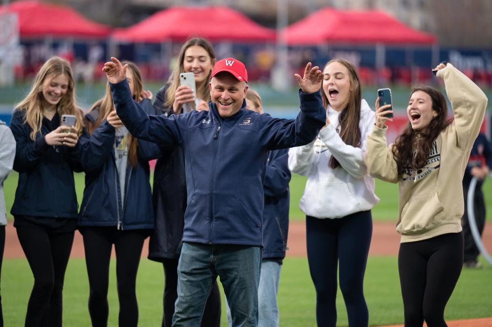 Shrewsbury girls hockey coach Frank Panarelli celebrates after throwing out the first pitch at Polar Park on Wednesday April 26, 2023.