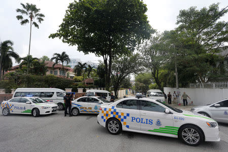 Police cars form a roadblock outside the sealed off North Korea embassy in Kuala Lumpur, Malaysia March 7, 2017. REUTERS/Lai Seng Sin