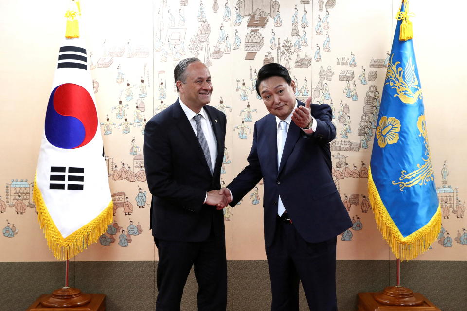 South Korean President Yoon Suk Yeol shakes hands with U.S. Second Gentleman Douglas Emhoff, after his inauguration ceremony, at the presidential office in Seoul, South Korea, May 10, 2022. / Credit: Chung Sung-Jun/Pool via REUTERS
