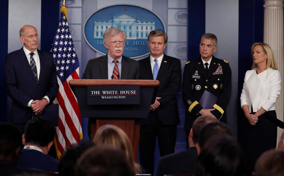 Director of National Intelligence Dan Coats, left, White House national&nbsp;security adviser John Bolton, FBI Director Christopher Wray, National Security Agency Director Paul Nakasone and Homeland Security Secretary Kirstjen Nielsen hold a briefing on election security on Thursday. &ldquo;Our democracy itself is in the crosshairs,&rdquo; Nielsen said. (Photo: Carlos Barria/Reuters)