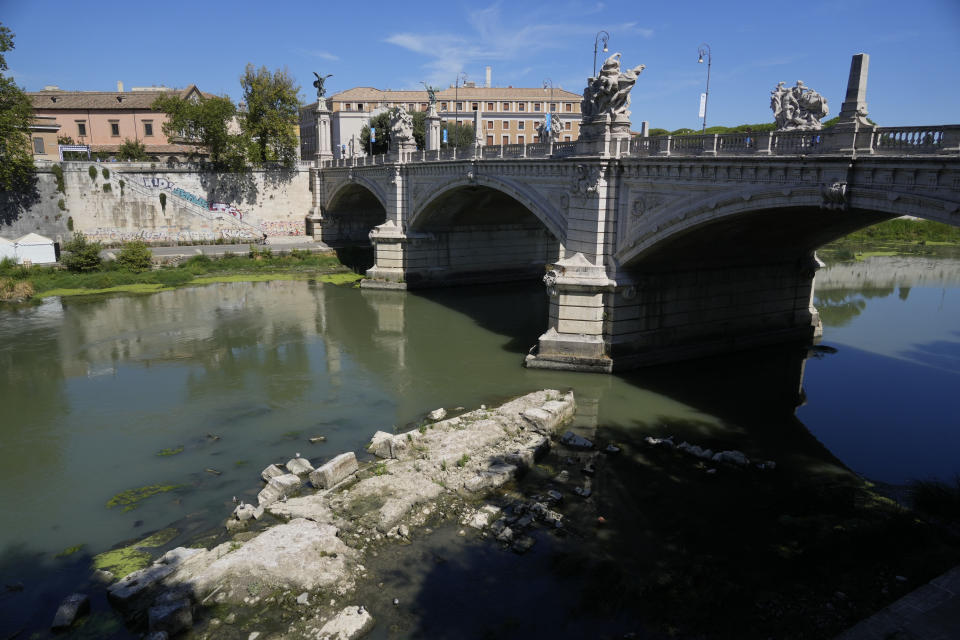 The ruins of the ancient Roman Neronian bridge, emerge from the river bed of the Tiber river, in Rome, Monday, Aug. 22, 2022. Italy’s worst drought in 70 years has exposed the piers of an ancient bridge over the Tiber River once used by Roman emperors but which fell into disrepair by the 3rd Century. (AP Photo/Gregorio Borgia)