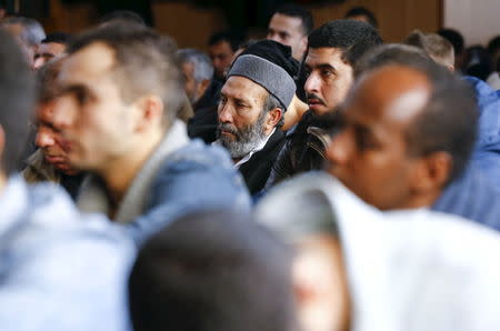 Men pray during a Friday prayer service at the Abu Bakr mosque of the Islamic Community Cologne in the city's suburb of Cologne Zollstock January 8, 2016. REUTERS/Wolfgang Rattay