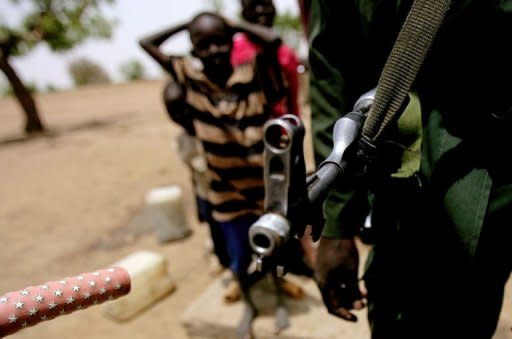 A Sudanese soldier patrols following clashes between the army and South Sudan's forces in the town of Talodi in South Kordofan, about 50 kms (30 miles) from the disputed frontier with South Sudan. The leaders of both countries accused the other of wanting war