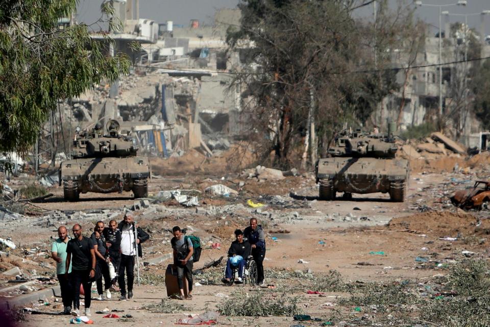 PHOTO: Palestinians flee to northern Gaza as Israeli tanks block the Salah al-Din Road in the central Gaza Strip, Nov. 24, 2023. (Mohammed Dahman/AP)