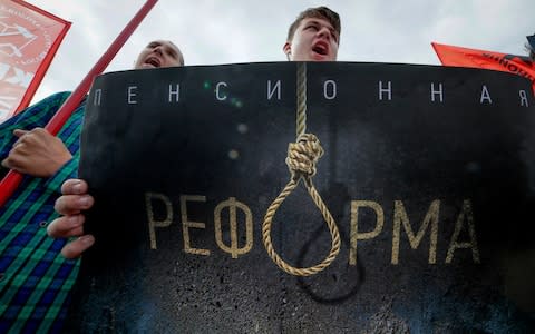 A sign with the words 'pension reform' at a protest in Moscow on Sunday - Credit: Dmitri Lovetsky/AP