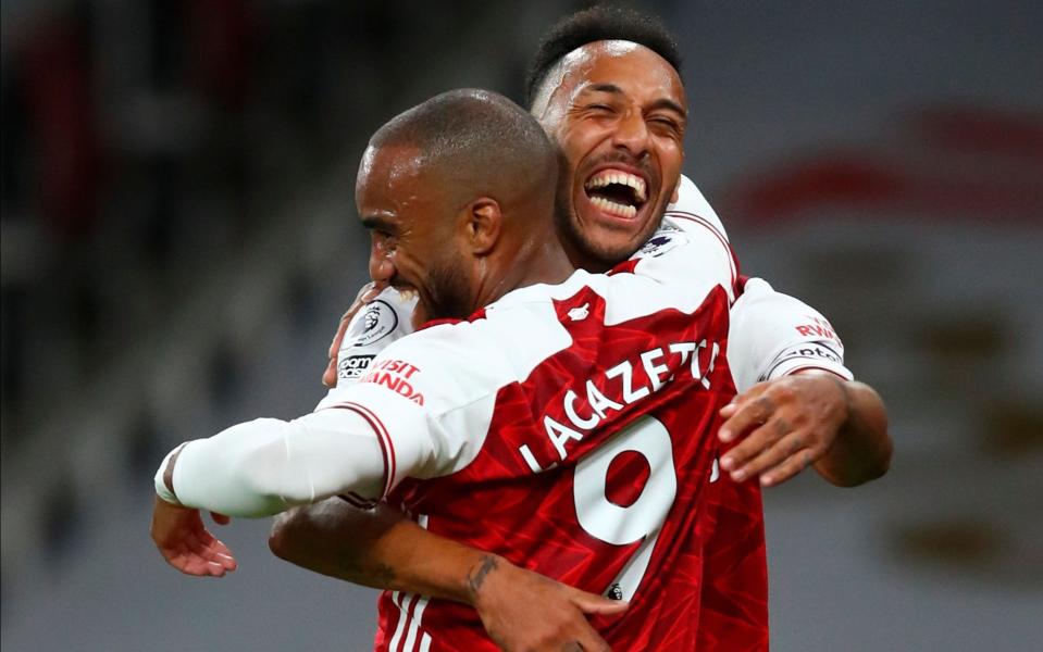 Arsenal's Alexandre Lacazette (L) celebrates with Pierre-Emerick Aubameyang (R) after scoring against West Ham  - Julian Finney/POOL/EPA-EFE/Shutterstock