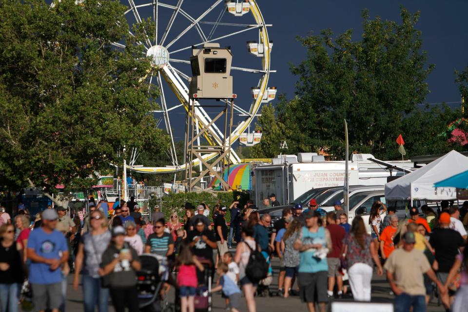 Visitors attend the San Juan County Fair, Thurday, Aug. 17, 2018 at McGee Park in this file photo.