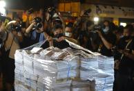 Last issue of Apple Daily arrive at a newspaper booth in Hong Kong, early Thursday, June 24, 2021. Hong Kong's pro-democracy Apple Daily newspaper will stop publishing Thursday, following last week's arrest of five editors and executives and the freezing of $2.3 million in assets under the city's year-old national security law. ( AP Photo/Vincent Yu)