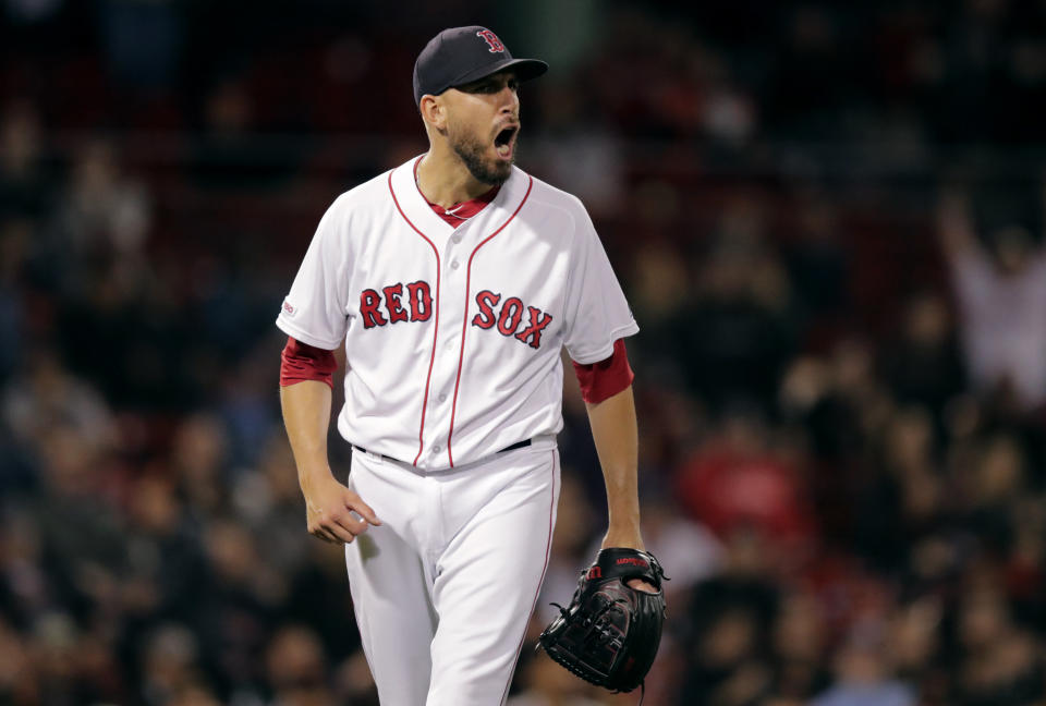 Boston Red Sox relief pitcher Matt Barnes cheers after teammates turned a double play, ending the top of the 10th inning of the team's baseball game against the San Francisco Giants at Fenway Park in Boston, Tuesday, Sept. 17, 2019. (AP Photo/Charles Krupa)