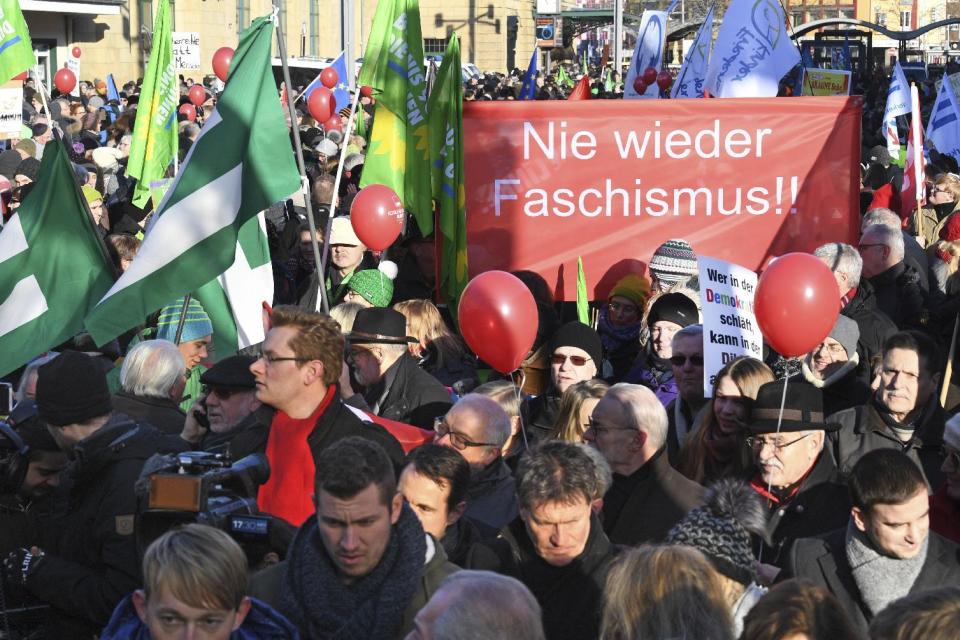 People demonstrate against a meeting of European nationalists in Koblenz, Germany, Saturday, Jan. 21, 2017. Dutch populist anti-Islam lawmaker Geert Wilders, AfD (Alternative for Germany) chairwoman Frauke Petry, far-right leader and candidate for next spring presidential elections Marine le Pen from France and Italian Lega Nord chief Matteo Salvini will attend the meeting. Banner reads "Never again Fascism". (Boris Roessler/dpa via AP)