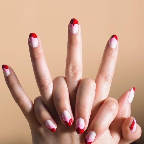 <p>Three Valentine's Day-inspired shades stacked in a cool and graphic heart-shaped design on the tip of the nail.</p><p><a href="https://www.instagram.com/p/BtW1I1qhnb1/" rel="nofollow noopener" target="_blank" data-ylk="slk:See the original post on Instagram;elm:context_link;itc:0;sec:content-canvas" class="link ">See the original post on Instagram</a></p>