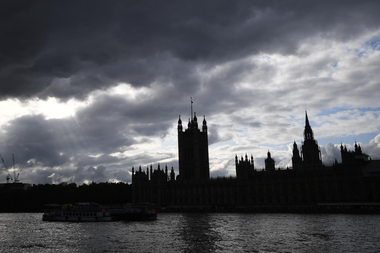 General view of the Palace of Westminster in shadow as dark clouds gather over Parliament.