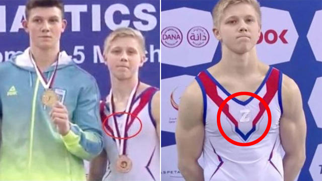 Russian gymnast stands on the podium with symbol supporting