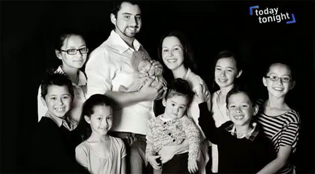 The couple with all of their eight children.