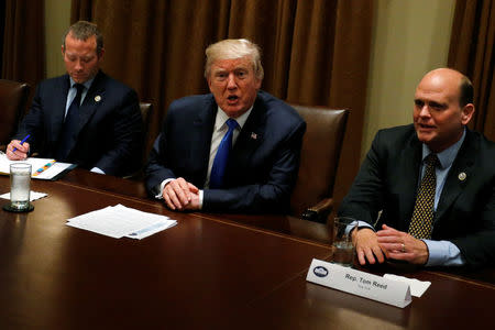 U.S. President Donald Trump meets with a bipartisan group of members of Congress, including U.S. Representative Josh Gottheimer (D-NJ) (L) and Representative Tom Reed (R-NY) (R), at the White House in Washington, U.S. September 13, 2017. REUTERS/Jonathan Ernst