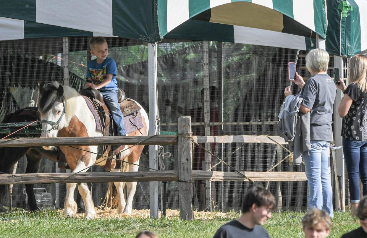 A boy rides a pony Eudora Farms Exotic Petting Zoo area, during opening day of The Great Anderson County Fair at the Anderson Sports and Entertainment Center in Anderson Thursday, May 4, 2023. The fair lasts 11 days, through May 14, with rides, shows, exhibits, and food. 