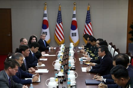 U.S. Defense Secretary Mark Esper talks to South Korean Defense Minister Jeong Kyeong-doo during their meeting in Seoul