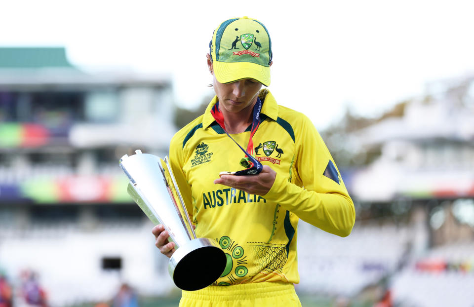 CAPE TOWN, SOUTH AFRICA - FEBRUARY 26: Meg Lanning of Australia holds the ICC Women's T20 World Cup alongside their winners medal following the ICC Women's T20 World Cup Final match between Australia and South Africa at Newlands Stadium on February 26, 2023 in Cape Town, South Africa. (Photo by Matthew Lewis-ICC/ICC via Getty Images)