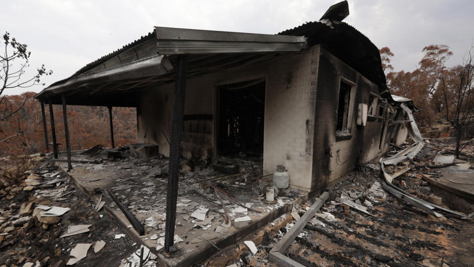 The home of Justin Kam and Helena Wong barely stands after a fire destroyed the house at Balmoral. Source: AAP