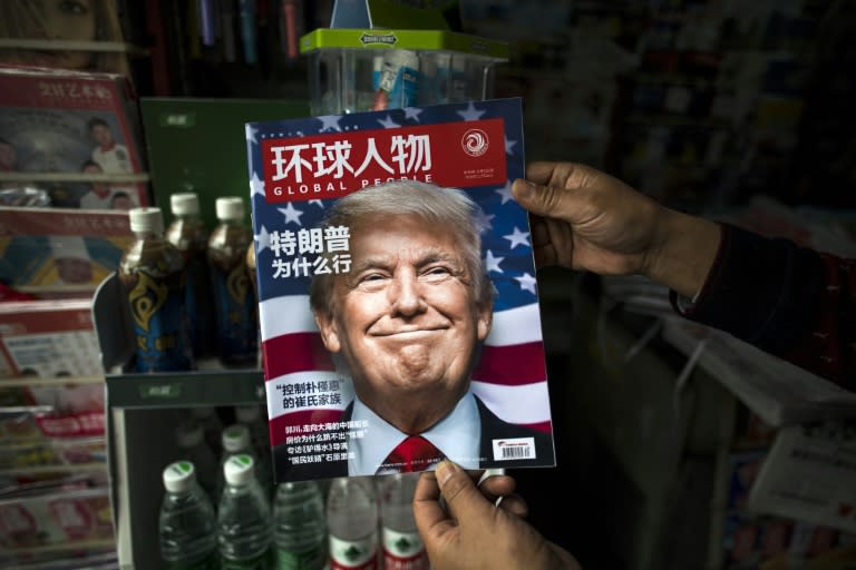 A copy of the Chinese magazine 'Global People' with a cover story that translates to "Why did Trump win" at a news stand in Shanghai