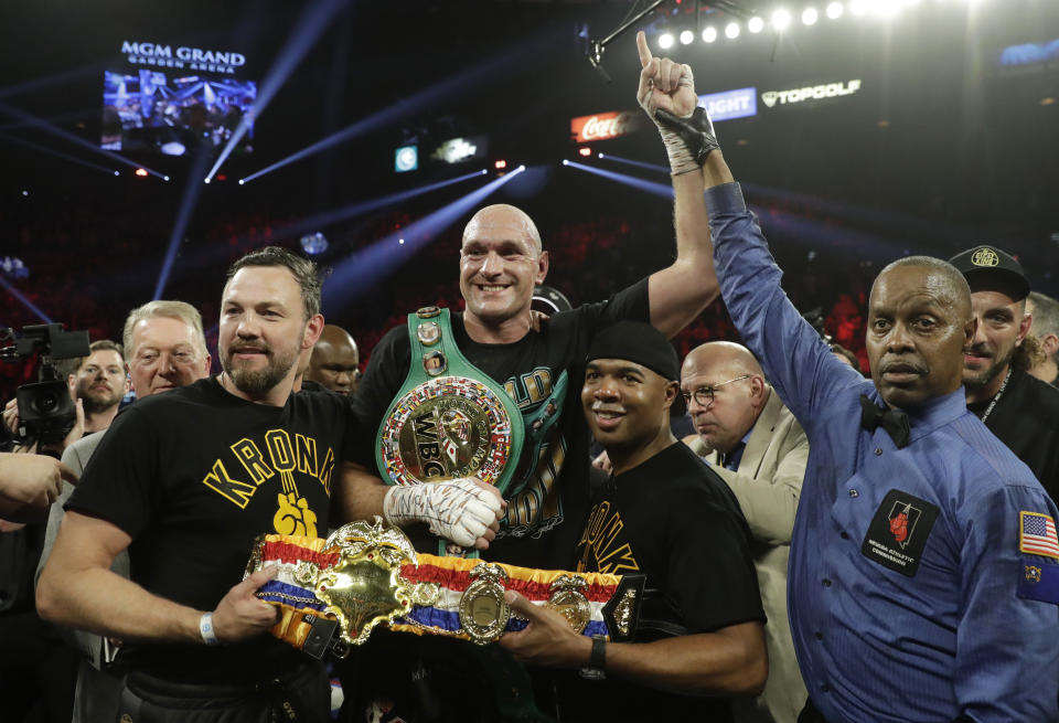 Tyson Fury, of England, celebrates after defeating Deontay Wilder during a WBC heavyweight championship boxing match Saturday, Feb. 22, 2020, in Las Vegas. (AP Photo/Isaac Brekken)