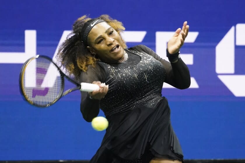 Serena Williams, of the United States, returns a shot to Danka Kovinic.