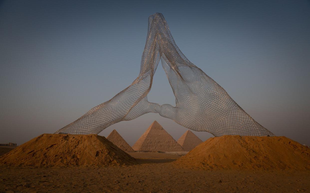  An installation titled Together on display at the Great Pyramids of Giza on October 23, 2021 in Cairo, Egypt