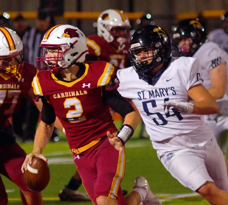 Cardinal Spellman QB #2 Matt O'Donnell was looking for a receiver when he saw open ground and decided to run with St. Mary's Jacob Peterson giving chase. O'Donnell had a big day for the Cardinals running the ball, and this run went for a big gain on Friday, Nov. 3, 2023.