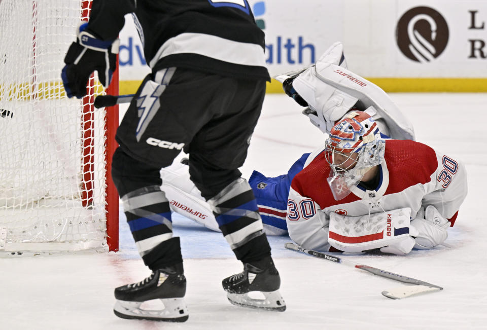 Tampa Bay Lightning center Brayden Point, not seen, scores on Montreal Canadiens goaltender Cayden Primeau (30) during the second period of an NHL hockey game Saturday, March 2, 2024, in Tampa, Fla. (AP Photo/Jason Behnken)