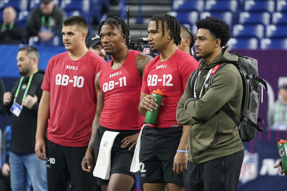 Alabama quarterback Bryce Young, right, watches drills with Purdue quarterback Aidan O'Connell, left, Florida quarterback Anthony Richardson and Ohio State quarterback CJ Stroud at the NFL football scouting combine in Indianapolis, Saturday, March 4, 2023. (AP Photo/Darron Cummings)
