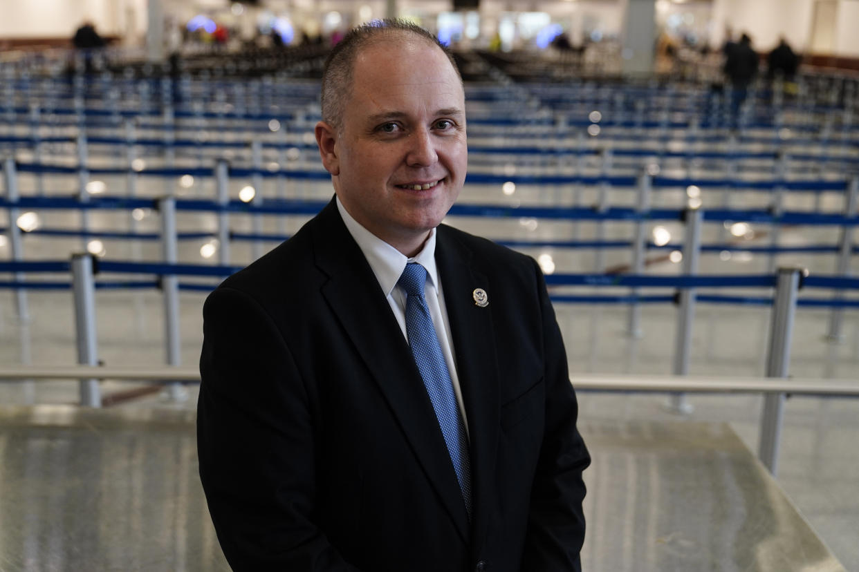 Robert Spinden, federal security director TSA for the state of Georgia poses for a portrait at the Transportation Security Administration security area at the Hartsfield-Jackson Atlanta International Airport on Wednesday, Jan. 25, 2023, in Atlanta. Spinden says the agency and the airport made a big effort in 2021 to try to address the large number of guns being intercepted at checkpoints. (AP Photo/Brynn Anderson)