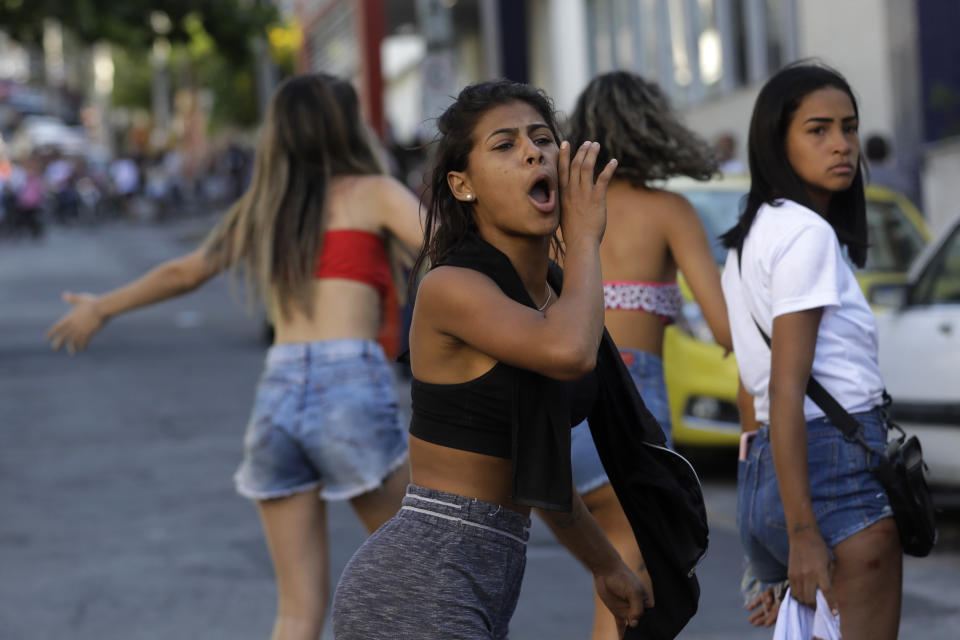 Residents protest against police near the Getulio Vargas Hospital after the police raided Vila Cruzeiro favela in Rio de Janeiro, Brazil, Tuesday, May 24, 2022. Police raided the favela before dawn Tuesday in an operation that prompted a fierce firefight and state officials said at least 11 people died. (AP Photo/Bruna Prado)