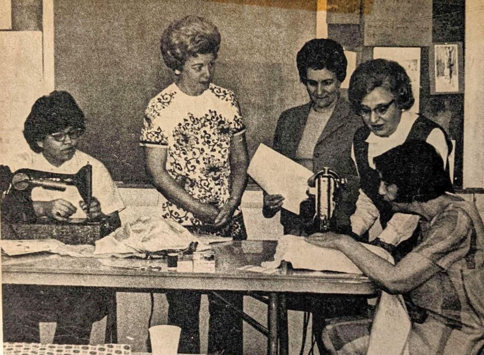 A  photo of a 1972  Dover Adult Basic Education sewing class, which was  supported with a generous donation of sewing machines.