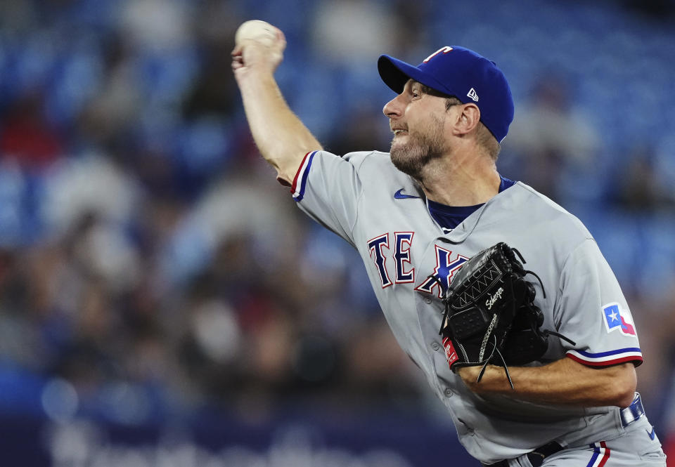 Texas Rangers starting pitcher Max Scherzer works against the Toronto Blue Jays during the first inning of a baseball game Tuesday, Sept. 12, 2023, in Toronto. (Nathan Denette/The Canadian Press via AP)