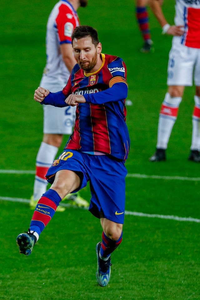 Barcelona’s Lionel Messi celebrates after scoring one of his two goals in a record-equalling 505th appearance for the club